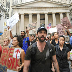 Occupy Wall Street Protest, with people holding signs