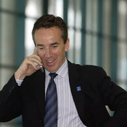man in suit talking on the phone