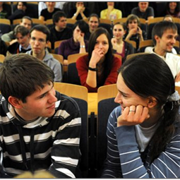 students flirting in the middle of a lecture hall