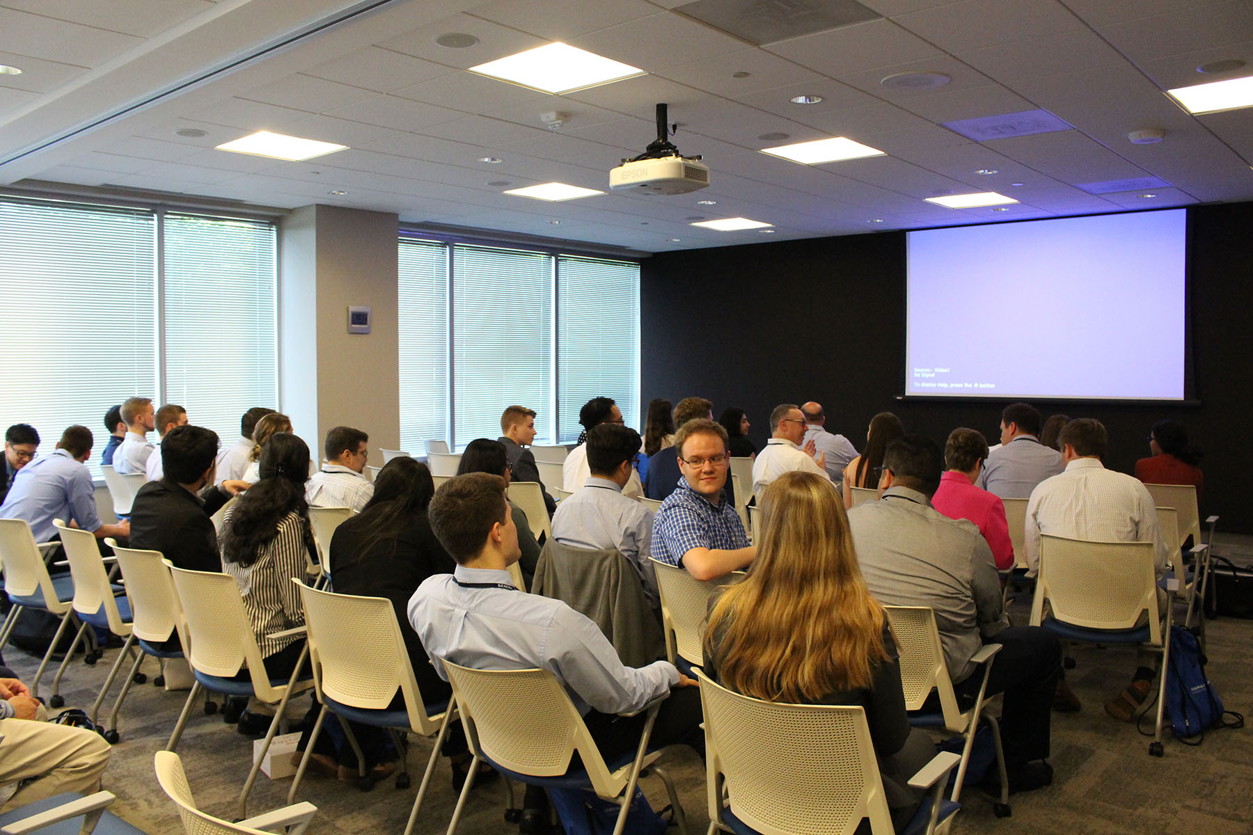 people gathered for a presentation