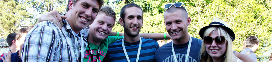 group of people with their arms around each other